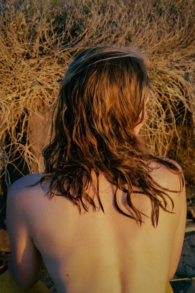 Photo Project Hochsommer. Blonde woman standing naked from behind